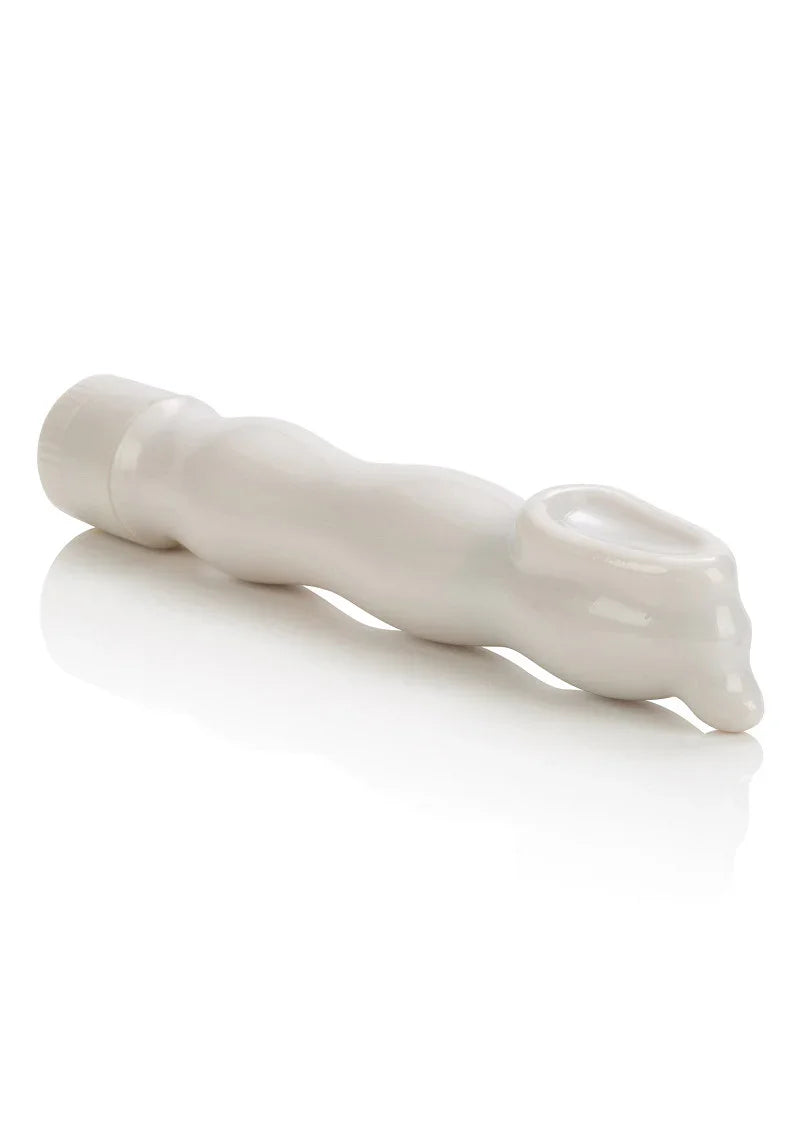 White CalExotics Clitoral Hummer vibrator with ergonomic curved design on reflective surface