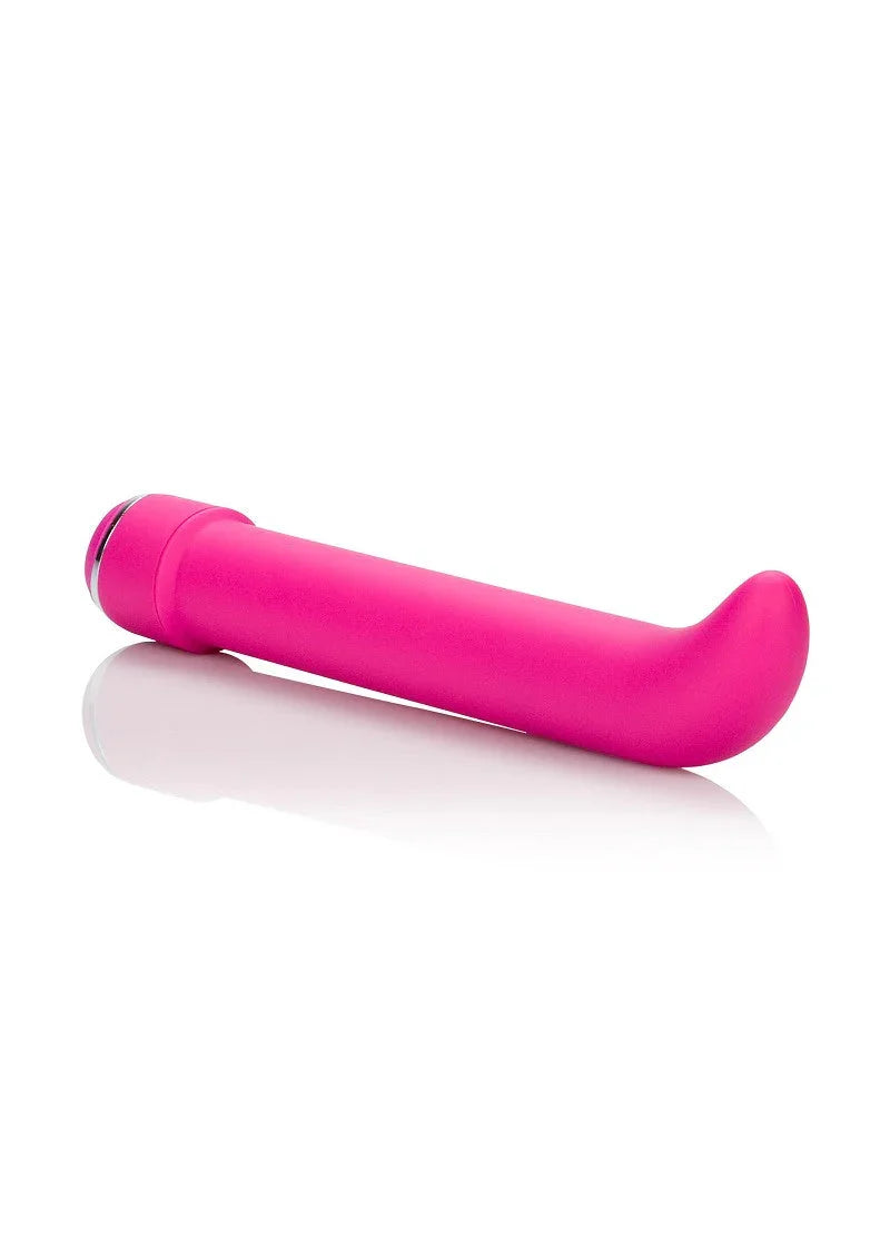 Pink silicone G-spot vibrator with curved tip and smooth texture on white background