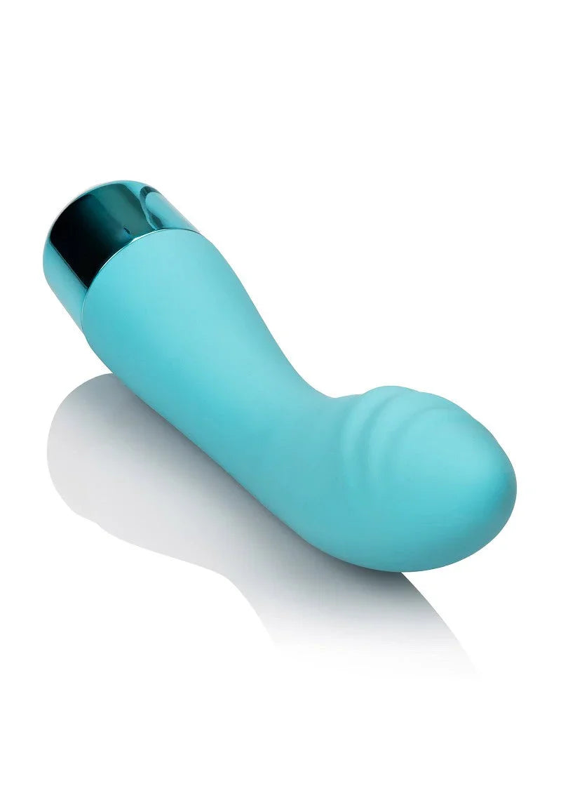 Light blue silicone G-spot vibrator with curved design and metallic base on white background