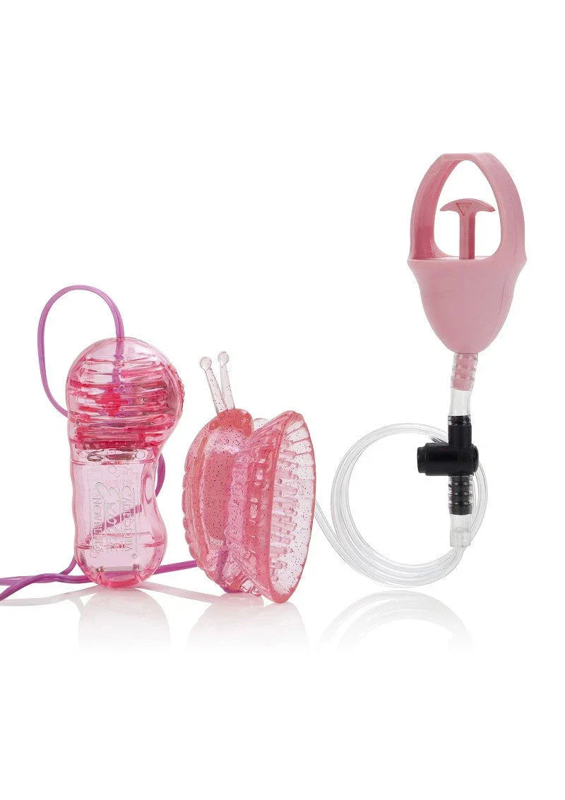 Pink translucent butterfly-shaped clitoral pump with hand pump and tubing on white background