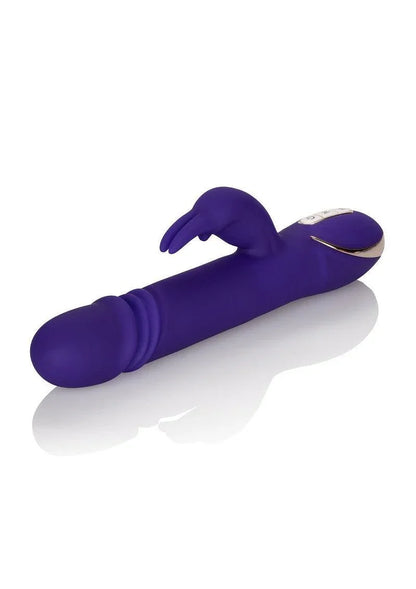 Purple silicone Jack Rabbit vibrator with thrusting feature and rabbit ear stimulator on white background