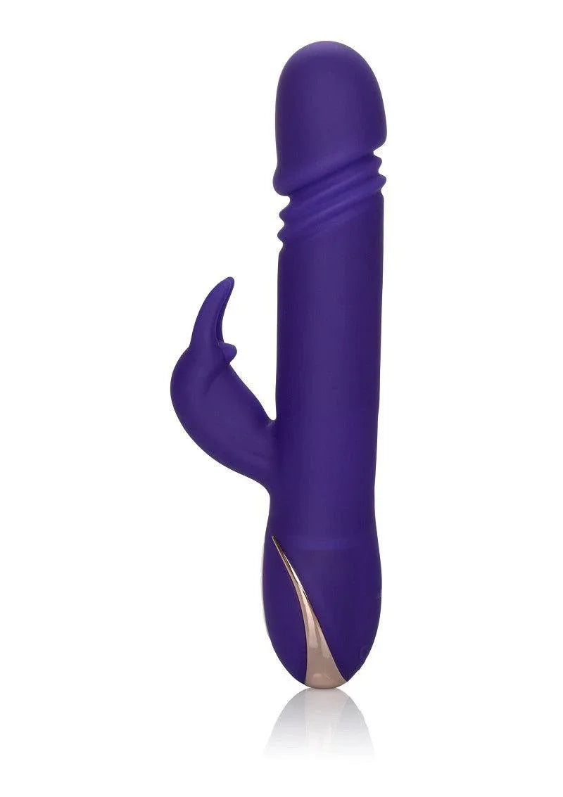 Purple silicone rabbit vibrator with textured shaft and curved clitoral stimulator on white background