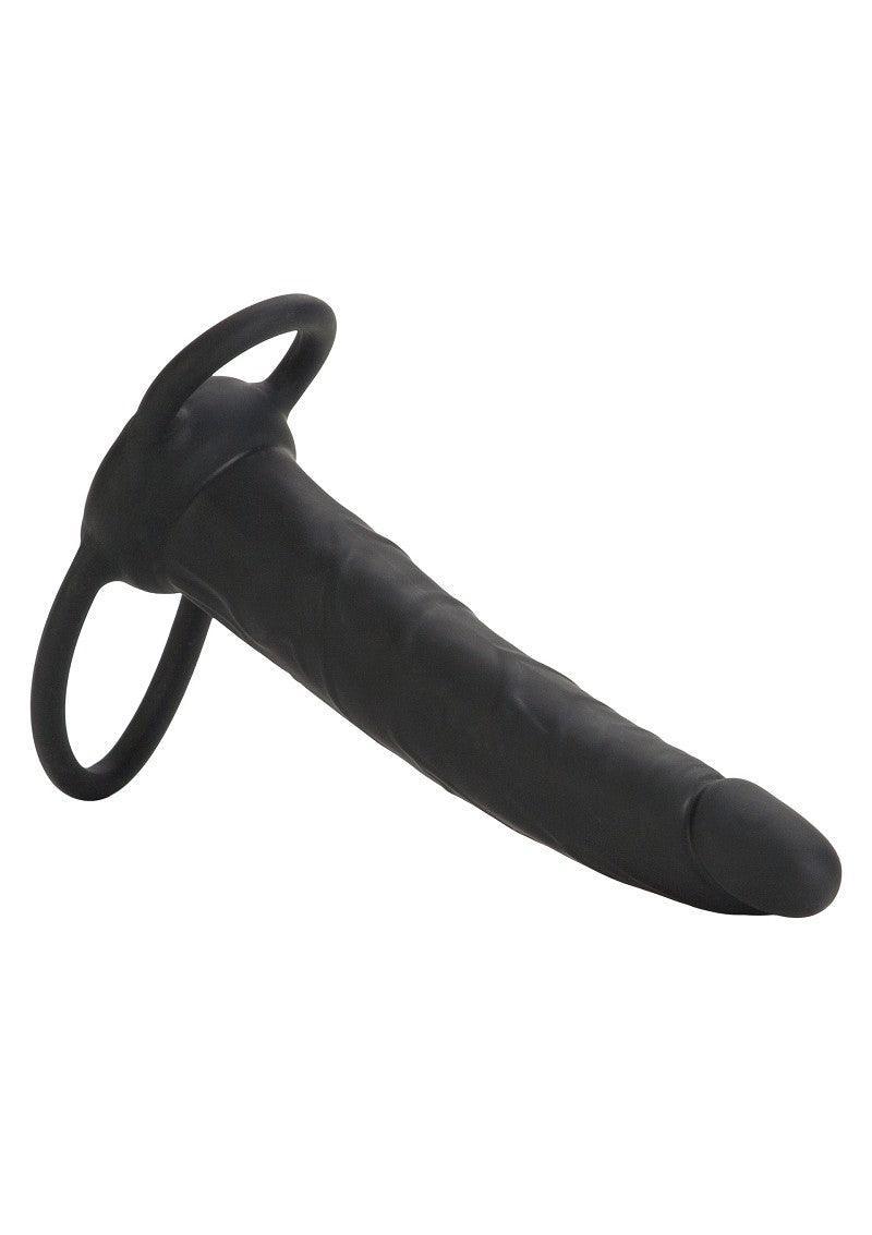 Black silicone double-ended strap-on with textured shaft and dual rings on white background