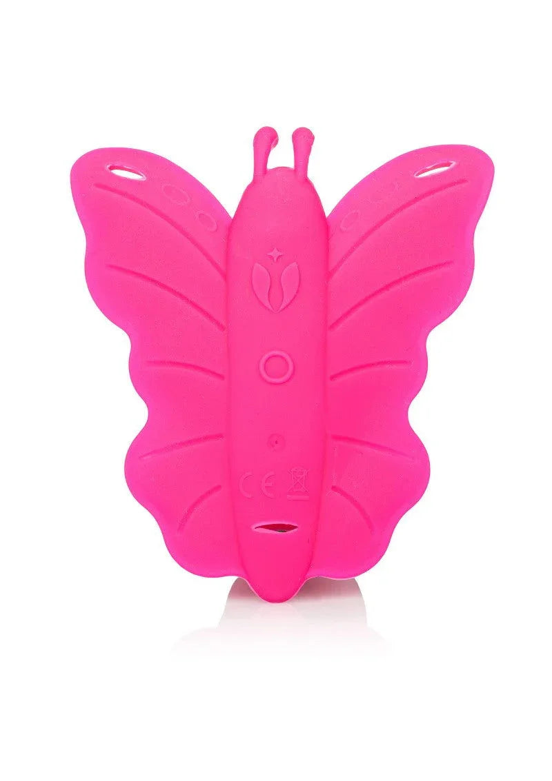 Pink butterfly-shaped silicone adult toy with textured wings and body on white background