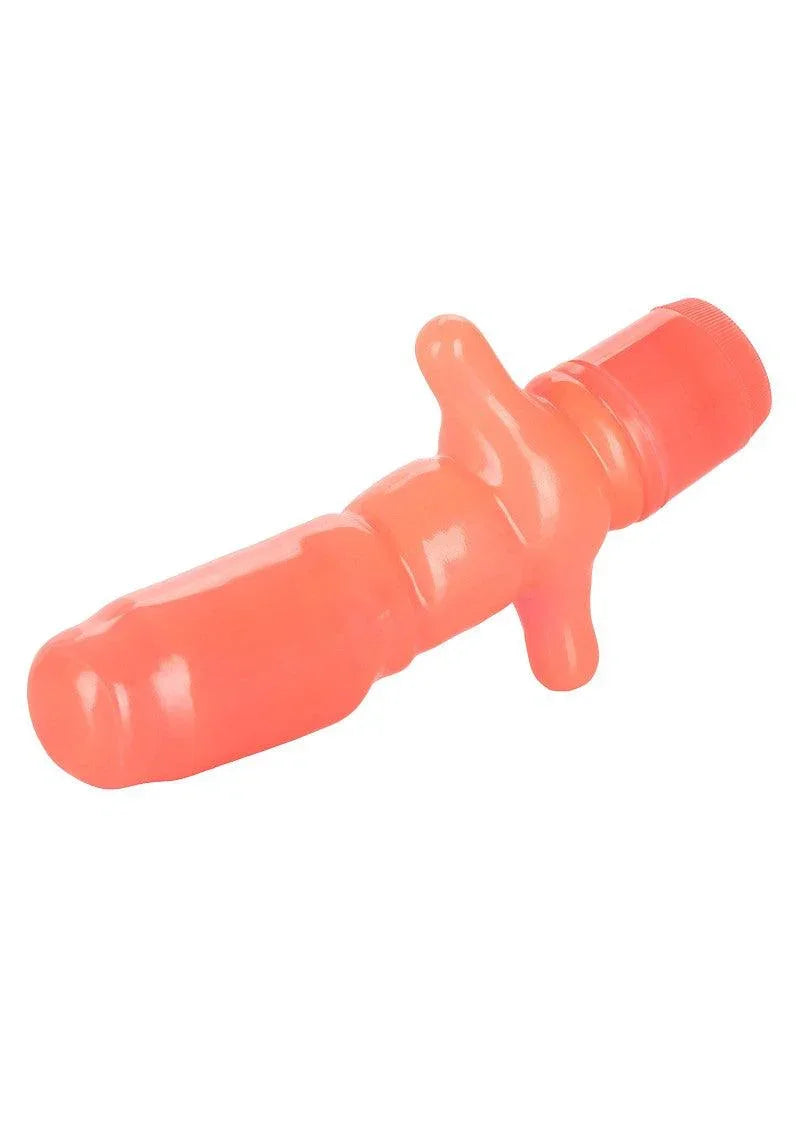 Coral pink vibrating anal probe with textured shaft and control dial on white background