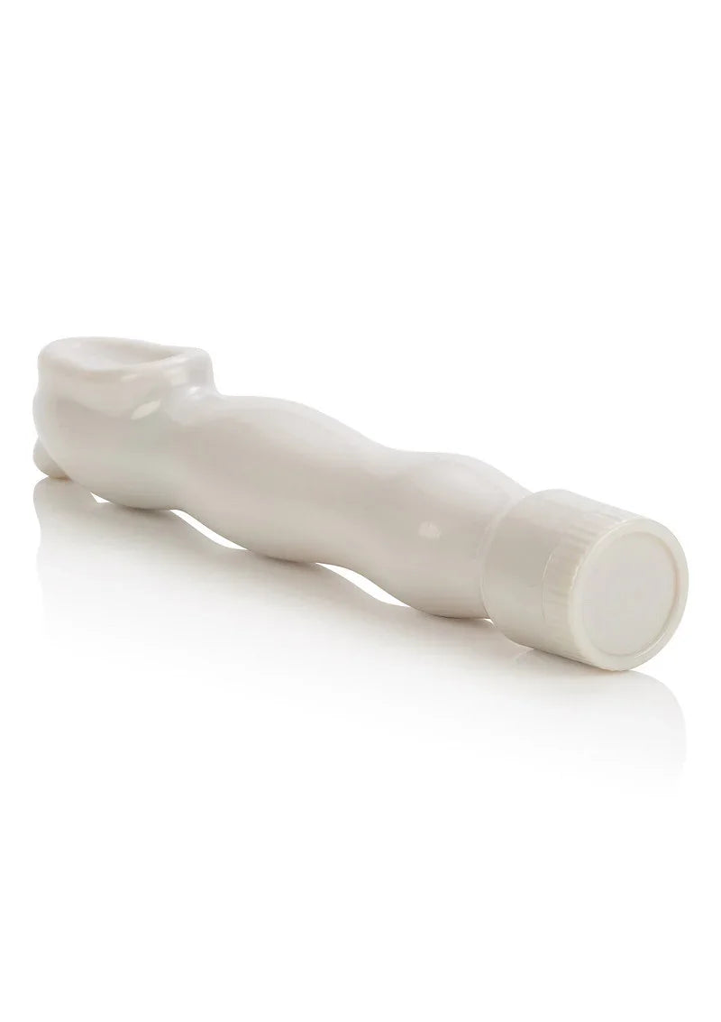 White curved clitoral stimulator sex toy with textured grip on a reflective white surface