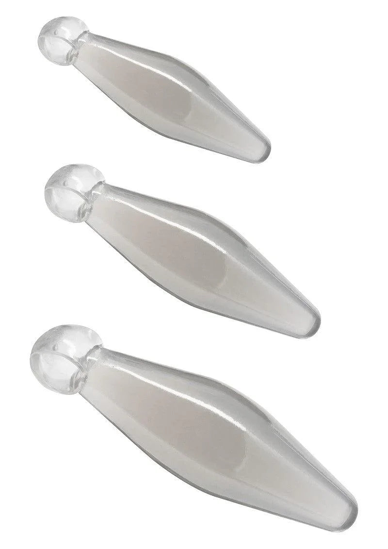 Set of three transparent glass finger rimmer anal play toys with rounded ends on white background