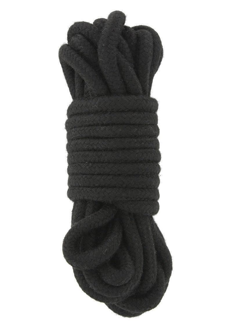 Coiled black soft bondage rope for adult BDSM play on white background