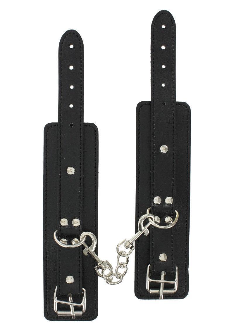 Black adjustable leather bondage wrist cuffs with metal buckles and chain connector