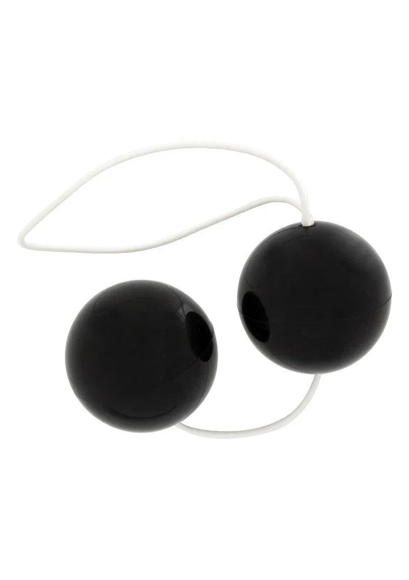 Black kegel balls connected by a white flexible silicone string for pelvic exercise and pleasure