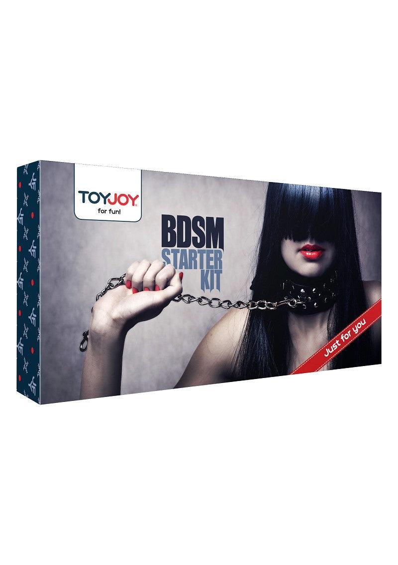 ToyJoy BDSM Starter Kit box featuring a woman with dark hair, red lipstick, holding a chain leash