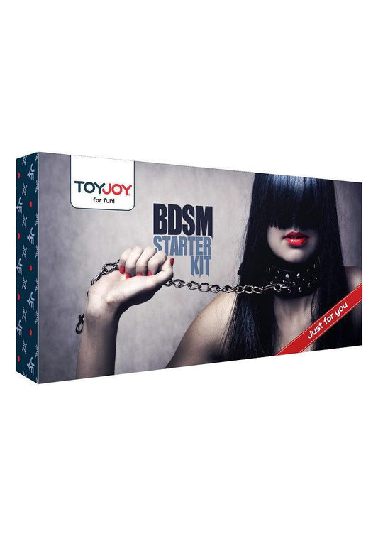 ToyJoy BDSM Starter Kit box featuring a woman with dark hair, red lipstick, holding a chain leash