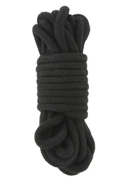 Coiled black soft braided rope for BDSM and bondage use in intimate settings
