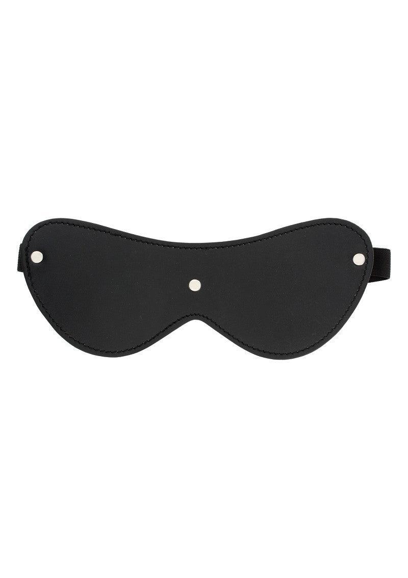 Black leather BDSM blindfold with metal studs and elastic strap on white background